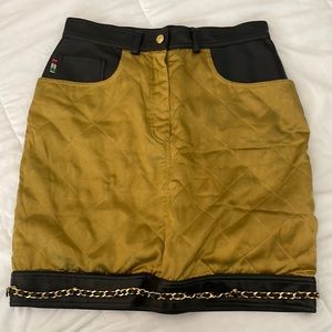 AUTHENTIC vintage Moschino gold and leather skirt with chains.